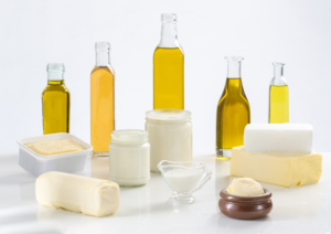 Various vegetable oils and dairy products displayed.